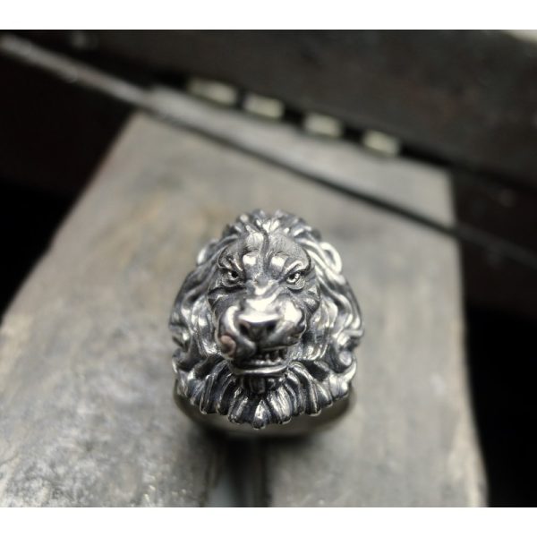 Introducing the Silver Lions Head Ring with Flowing Mane - a stunning piece of Irish jewelry that embodies power and strength. With its intricate design and captivating detail, this ring is the perfect accessory for anyone who wants to make a bold stateme