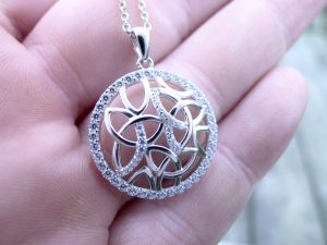 A ring of iced crystals surround a contemporary Irish jewellery design in the form of a necklace
