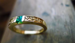Celtic ring set with an Emerald . Irish jewellery