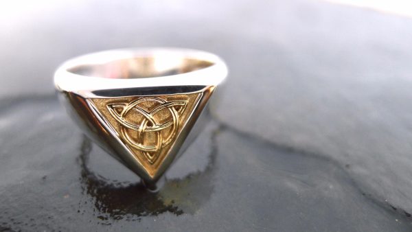Handcrafted Irish Celtic Ring | Irish Jewellery| Silver and gold Celtic knot ring Photograph of a Handcrafted Celtic ring with an inlaid panel Irish gold